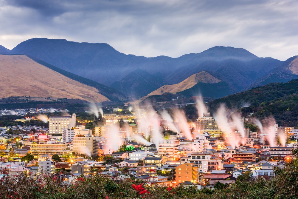 Beppu, Japan cityscape with hot spring bath houses with rising steam