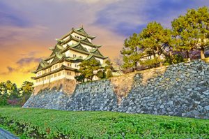 Nagoya Castle with evening sunlight and twilight sky in Nagoya City