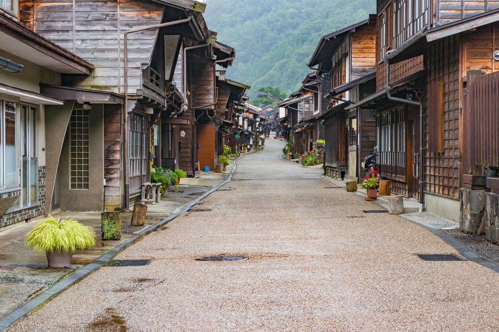 Picturesque view of old Japanese town with traditional wooden houses. Narai-juku post town in Kiso Valley, Japan