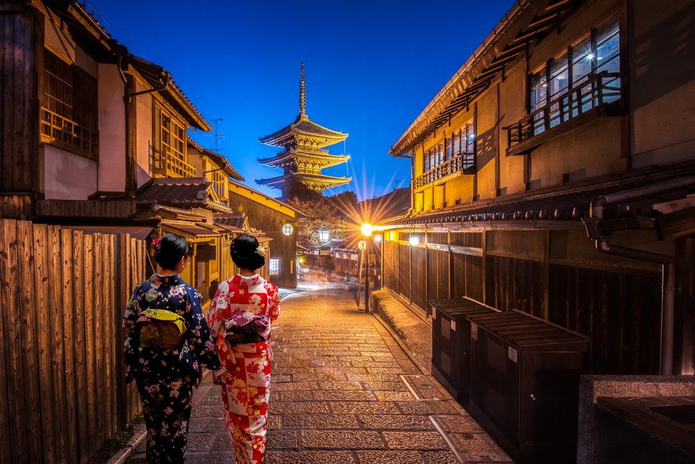 Young women wearing traditional Japanese Kimono at Yasaka Pagoda and Sannen Zaka Street in Kyoto, Japan