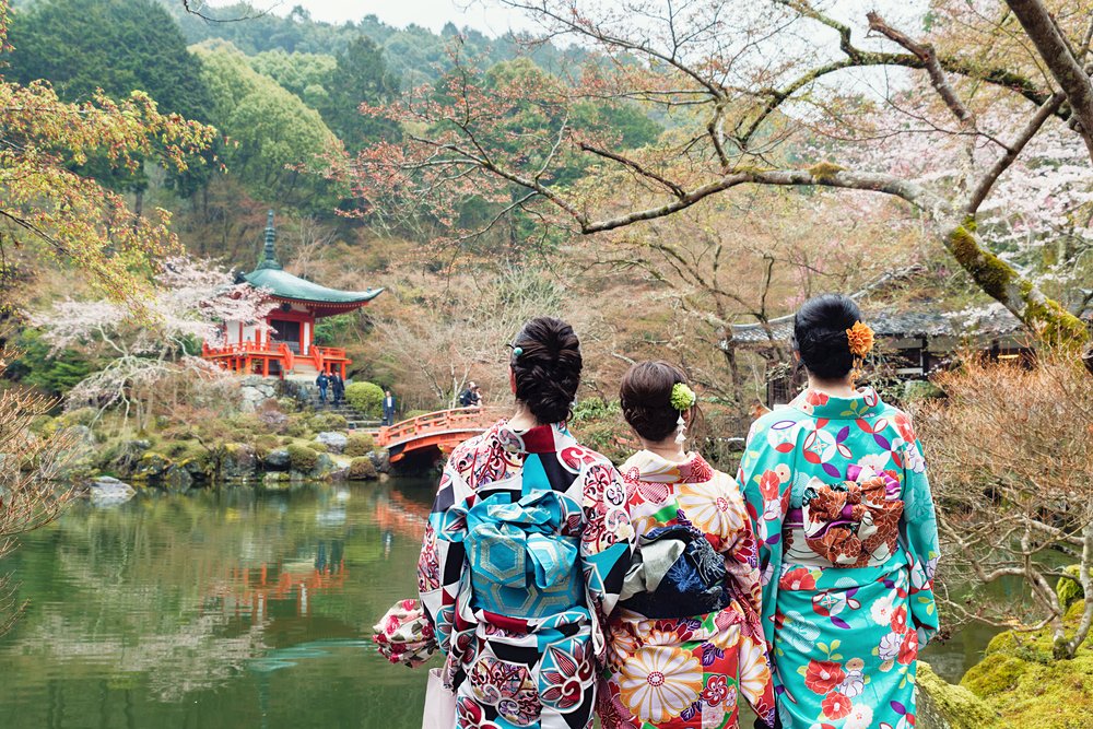 three girls wearing Japan kimono standing in front of Daigoji Temple in Kyoto